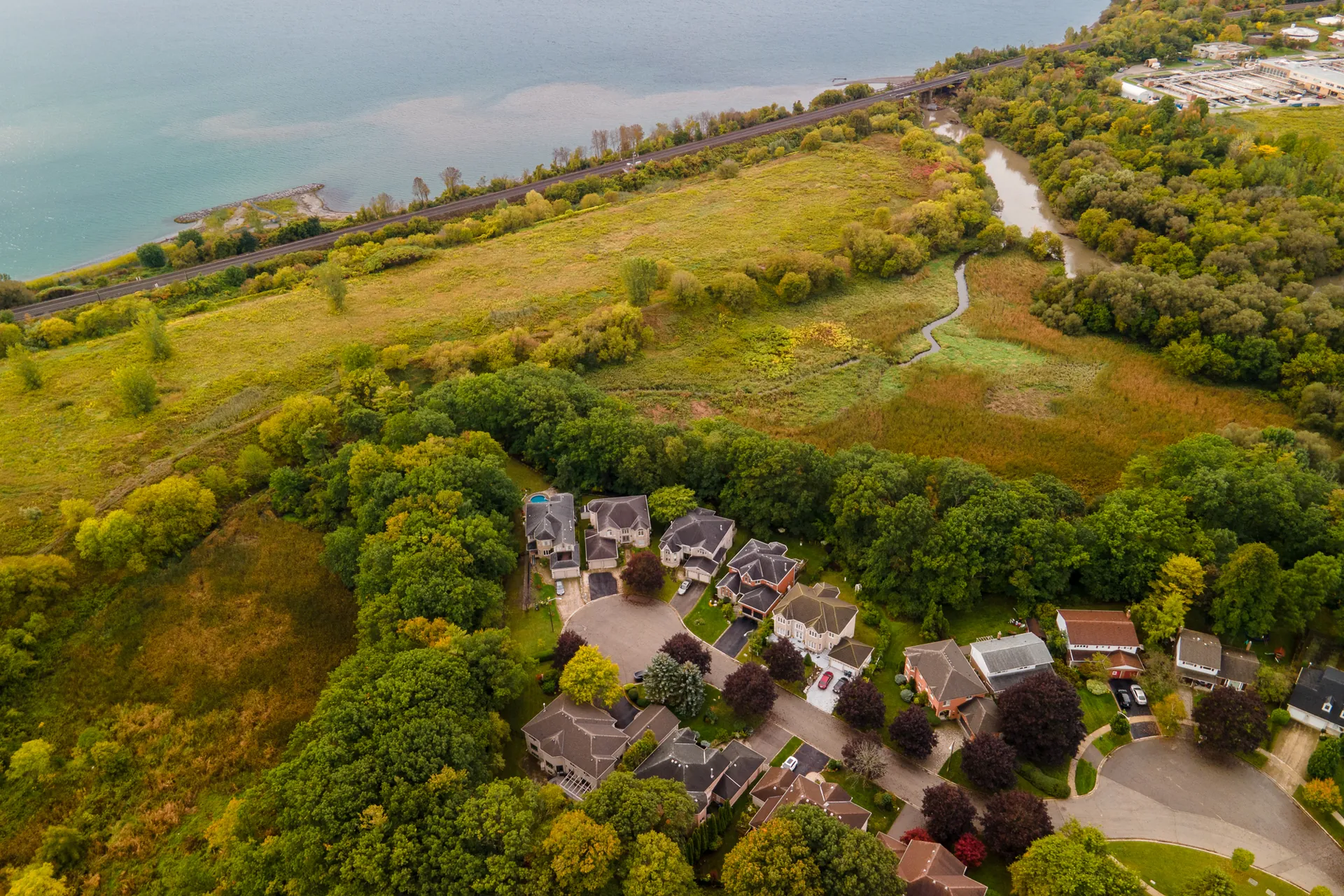 Aerial view of the cul-de-sac surrounded by the ravine, with Lake Ontario beyond
