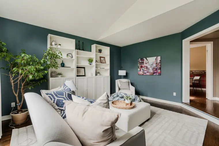 Formal living room with built-in shelving